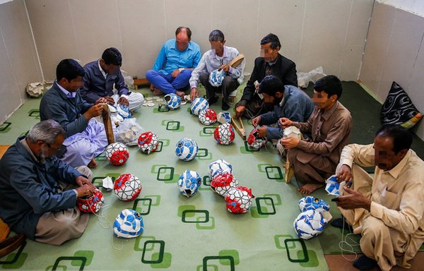 Zahedan prison inmates in Sistan and Baluchestan province sewing soccer balls in 2019. [Khabaronline.ir]