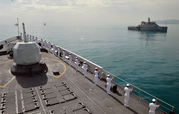 Chinese sailors aboard the guided-missile frigate saluting a Tunisian patrol vessel after crossing out of Egypt's Suez Canal. [Chinese Ministry of Defence]