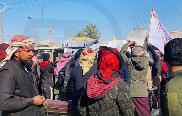 Deir Ezzor residents protest against the proliferation of corruption in their city on December 6. [Deir Ezzor 24/Facebook]
