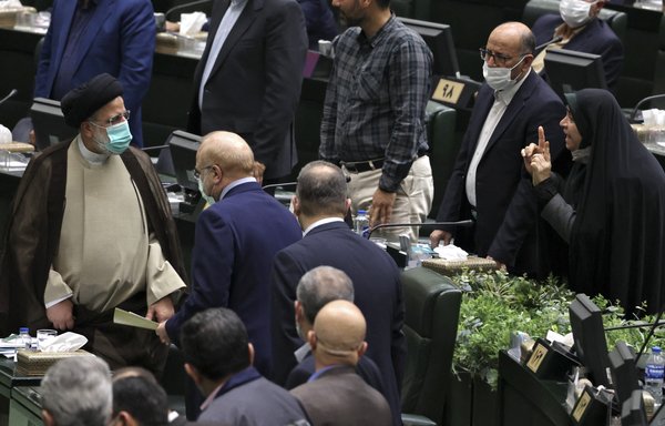 Iranian President Ebrahim Raisi is seen here after a speech in the Iranian parliament (Majles) on December 1. [Atta Kenare/AFP]