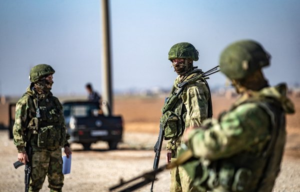 Russian soldiers in Syria in January. [Delil Souleiman/AFP]
