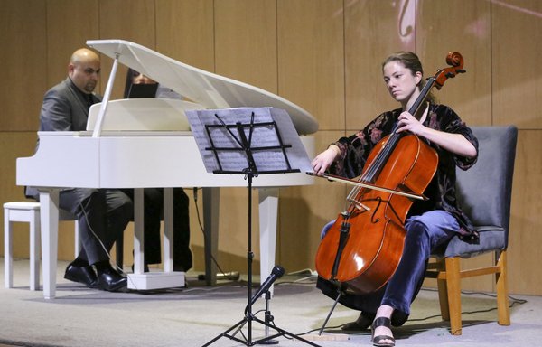 Pianist Ahmed Mahmoud and cellist Sofia Nitti perform in Baghdad on December 2. [Sabah Arar/AFP]