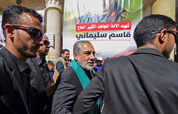 Iranian ambassador Hassan Eyrlou attends a vigil in Sanaa on January 2 to mark the one-year anniversary of the death of IRGC Quds Force commander Qassem Soleimani. Eyrlou, who is sick with COVID-19, was flown back to Tehran on December 18 for treatment. [Mohammed Huwais/AFP]