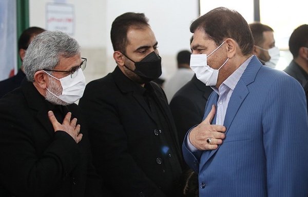 IRGC Quds Force commander Esmail Qaani (L) attends Hassan Eyrlou's December funeral in Tehran along with Vice President Mohammad Mokhber (R). [Tasnim News]