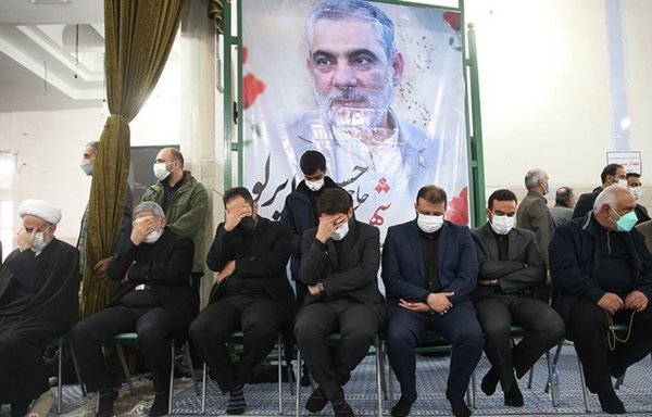 IRGC dignitaries mourn the death of Hassan Eyrlou beneath his portrait in Tehran in December. Eyrlou died of COVID-19. [Tasnim News]