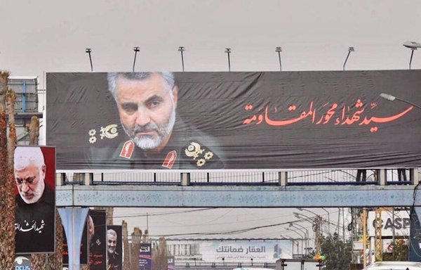 Billboards and pictures of Qassem Soleimani and Abu Mahdi al-Muhandis line the airport road in Beirut. [Ziad Hatem/Al-Mashareq]