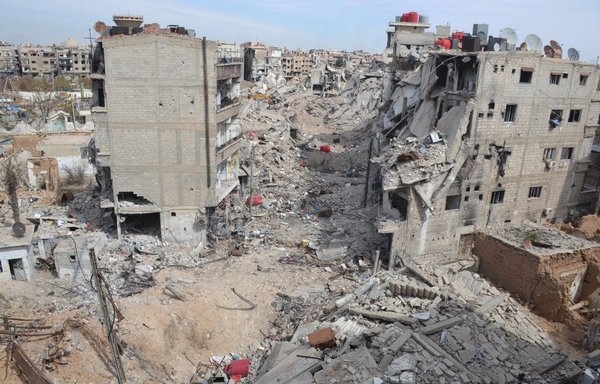 Al-Baladya street near the Sayyida Sakina shrine of Sakina in Daraya can be seen damaged in 2015. [Ahmad al-Sisi]