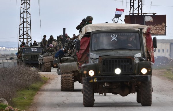 Syrian government forces deploy on a highway near Damascus. [AFP]