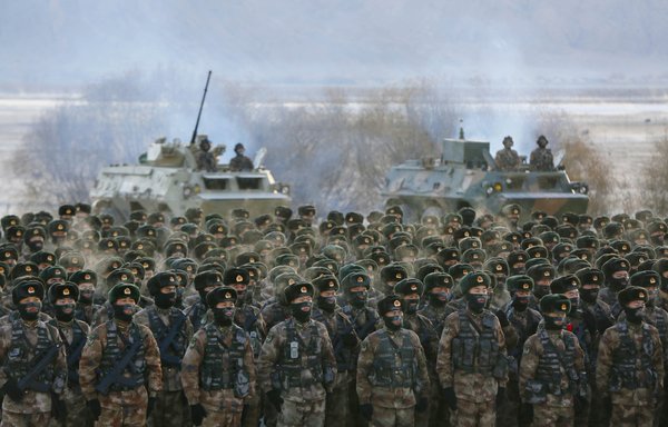 This photo taken on January 4, 2021, shows Chinese PLA soldiers assembling during military training in the Pamir Mountains in Kashgar, Xinjiang region. [STR/AFP]
