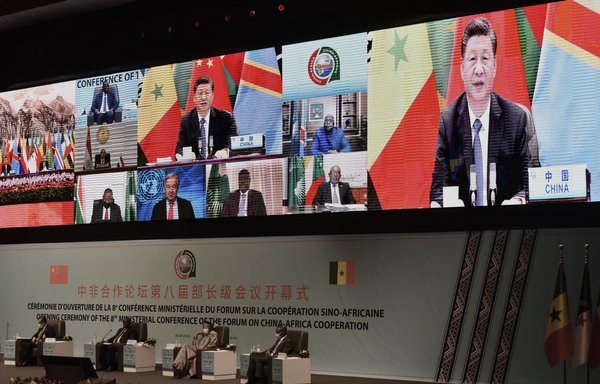 Chinese President Xi Jinping (on the screen) delivers his speech during the China-Africa Co-operation (FOCAC) meeting in Dakar, Senegal, last November 29. [Seyllou/AFP]