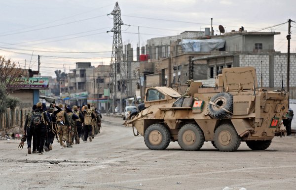 A vehicle belonging to the international coalition parks on a street in the northern Syrian city of al-Hasakeh on January 24. [AFP]