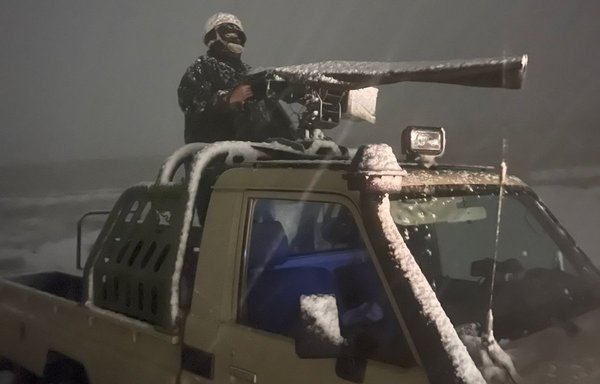 A Jordanian border guard manning a gun on a truck during the clash with drug traffickers on January 27. [Jordanian Armed Forces]