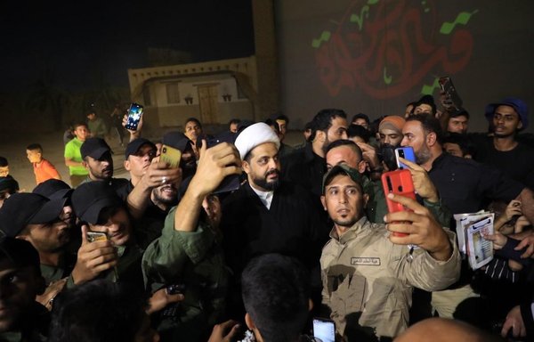 Asaib Ahl al-Haq militia leader Qais al-Khazaali is seen here on November 4, 2021, with a number of his followers. [Al-Khazaali/Twitter]