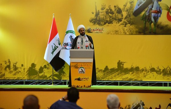 Asaib Ahl al-Haq leader Qais al-Khazaali speaks during a June 29, 2019, ceremony. [Al-Khazaali/Twitter]