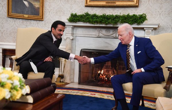 US President Joe Biden participates in a bilateral meeting with Qatar's emir, Sheikh Tamim Bin Hamad Al-Thani, in the Oval Office of the White House on January 31 in Washington, DC. [Nicholas Kamm/AFP]