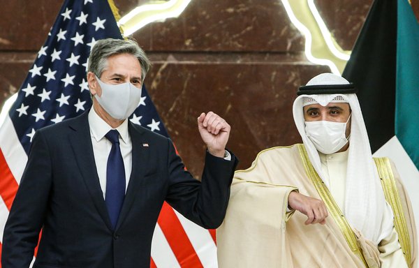 US Secretary of State Antony Blinken and Kuwaiti Foreign Minister Sheikh Ahmad Nasser al-Mohammed Al Sabah elbow bump each other during a press conference at Kuwait's foreign ministry headquarters in Kuwait City last July 29. The two took part in a strategic dialogue in Washington that concluded January 26. [Yasser al-Zayyat/AFP]