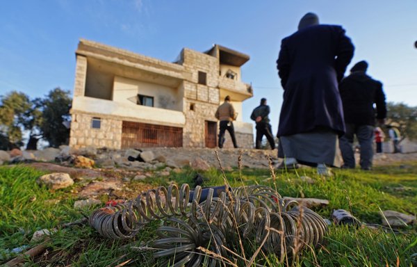A military device lies on the ground on February 3 following an overnight raid by US special operations forces in Atme, in Syria's northwestern province of Idlib, during which the ISIS leader blew himself up. [Muhammad Haj Kadour/AFP]