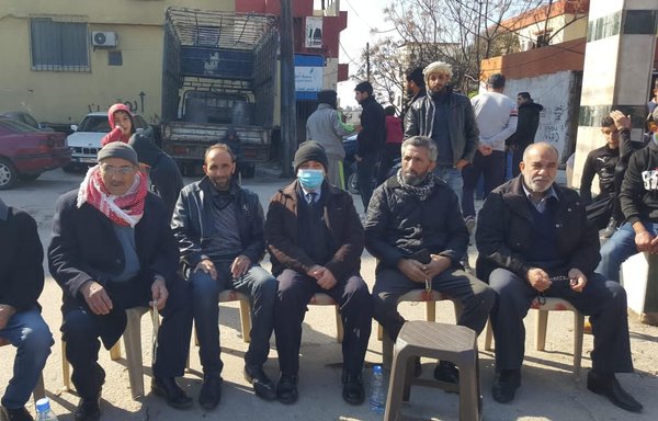 Residents of the village of Wadi al-Nahla, Tripoli district, hold a wake for Omar and Youssef Shkhaidem, who are thought to have been killed in Iraq after joining ISIS. [Mohamed Seif]