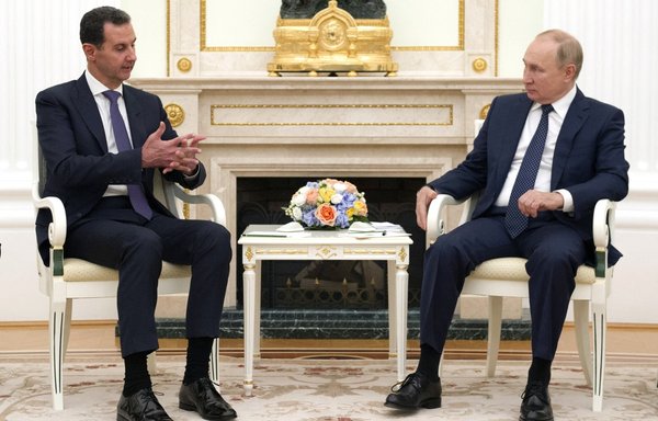 Syrian President Bashar al-Assad meets with Russian President Vladimir Putin in Moscow September 13. [Mikhail Klimentyev/Sputnik/AFP]