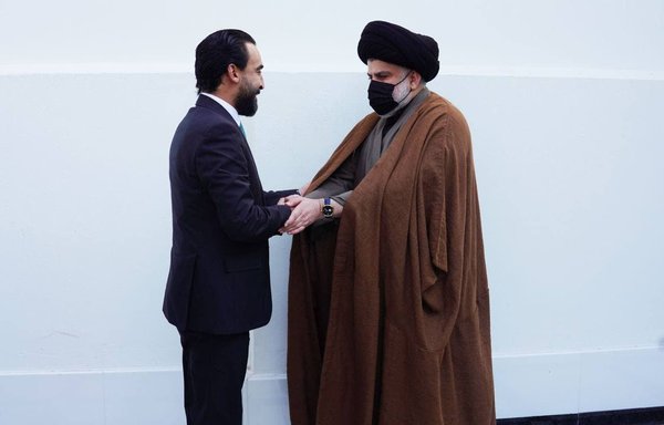 Shia cleric and election winner Muqtada al-Sadr greets Iraqi Parliament Speaker Mohammed al-Halbousi on January 4. [File]