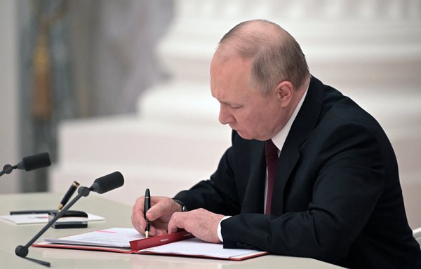 Russian President Vladimir Putin on February 21 signed a decree recognising two Russian-backed breakaway regions in eastern Ukraine as independent. The move sparked global outrage as Kyiv's allies say it amounts to a declaration of war on Ukraine. [Alexey Nikolsky/Sputnik/AFP]