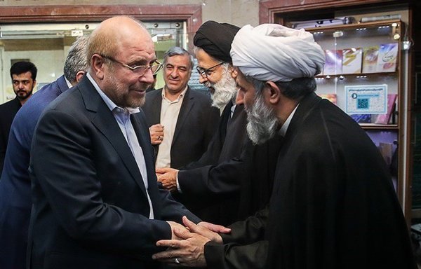 Iran's Majles Speaker Mohammad-Bagher Ghalibaf (L) and IRGC's Intelligence director Hossein Taeb shake hands in 2019. [Eghtesadonline.ir]