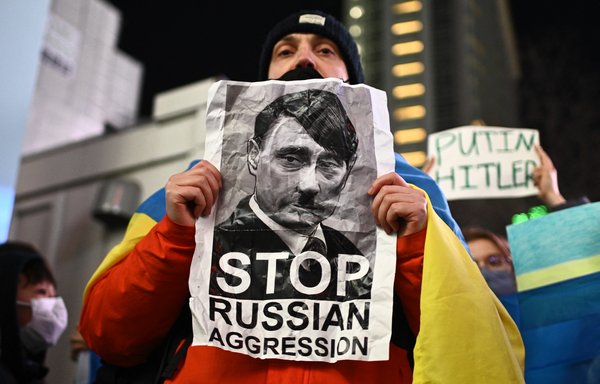 A man participates in a protest against Russia's actions in Ukraine during a rally in Tokyo on February 24. [Philip Fong/AFP]