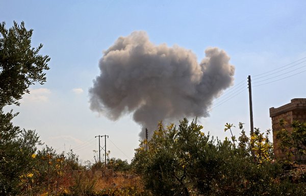 Smoke rises during a reported air strike by Russian forces targeting the outskirts of al-Bara in southern rural Idlib, on November 13, 2020. [Mohammed al-Rifai/AFP]