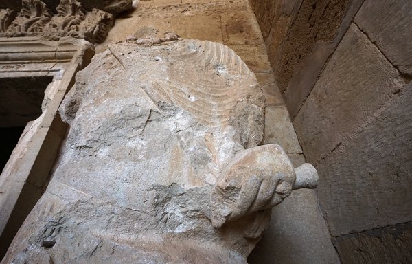 A picture taken on February 24 shows a view of a restored sculpture, which that was vandalised by ISIS in 2015, during an unveiling ceremony in the ancient city of Hatra south of Mosul. [Zaid al-Obeidi/AFP]