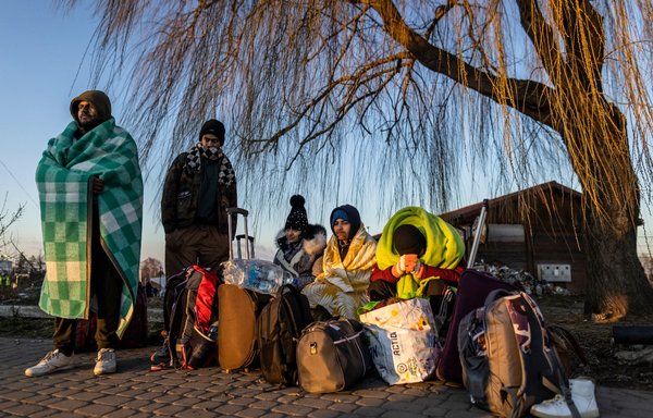 Refugees from Ukraine as seen at the border crossing in Medyka, eastern Poland, on February 28. Overall, more than half a million people have fled Ukraine since Moscow launched a full-scale invasion on February 24. [Rojtek Radwanski/AFP]