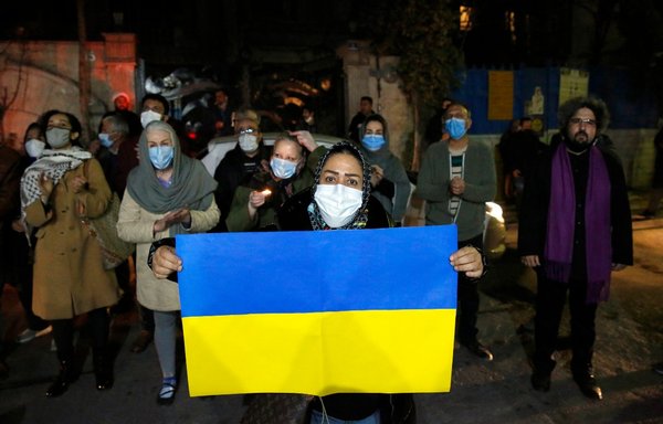 Iranians and Ukrainian nationals rally in front of the Ukraine embassy in Tehran, on February 26, to show support for Kyiv and protest the Russian invasion. [AFP]