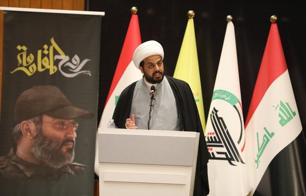 Asaib Ahl al-Haq leader Qais al-Khazaali attends a memorial ceremony in Baghdad on February 23, 2018, to commemorate the killing of prominent Lebanese Hizbullah commander Imad Mughniyeh. [Qais al-Khazaali/Twitter]