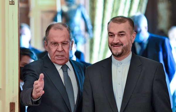 Russian Foreign Minister Sergey Lavrov welcomes his Iranian counterpart Hossein Amir-Abdollahian prior to their meeting in Moscow on October 6. [Kirill Kudryavtsev/Pool/AFP]