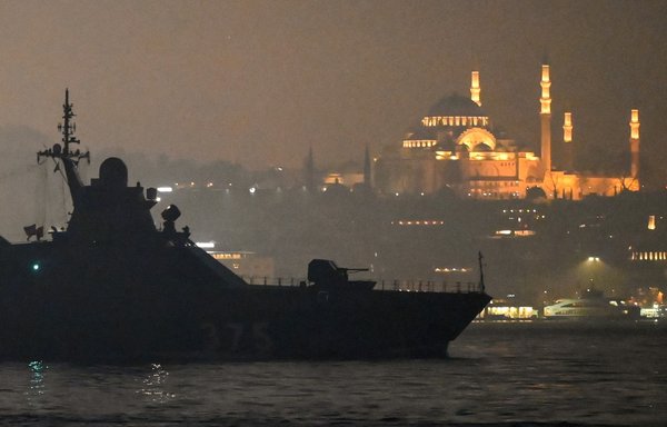 A Russian Navy patrol vessel sails through the Bosphorus strait on the way to the Black Sea past Istanbul, with Suleymaniye mosque in the background, on February 16. [Ozan Kose/AFP]