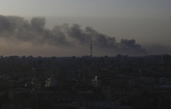 Smoke rising above the Ukrainian capital of Kyiv on March 19. [Aris Messinis/AFP]