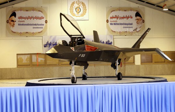 Iran's domestically designed and built Qaher-313 fighter jet is unveiled during a ceremony in a warehouse in Tehran on February 2, 2013. But the fighter jet is still not in service, and has been widely derided. [AFP Photo/Mehr News/Younes Khani/AFP]