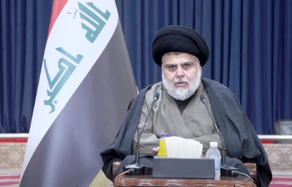 Shia cleric Muqtada al-Sadr is seen in this screenshot from a video posted November 24 during his meeting with a number of independent MPs who won in the last Iraqi parliamentary elections. [Al-Sadr office/YouTube]