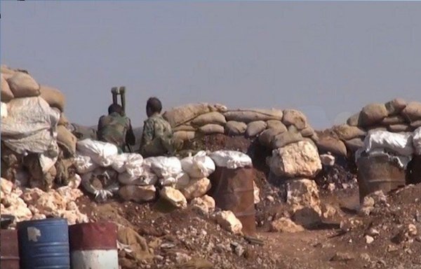 Harakat al-Nujaba elements are seen here at a new post the militia established in the Syrian village of Rusafa. [Nedaa al-Furat]