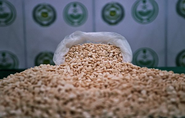 This picture taken March 1 shows a cache of Captagon pills seized by the Directorate of Narcotics Control of Saudi Arabia's Interior Ministry during a special operation, displayed in Jeddah. [Fayez Nureldine/AFP]