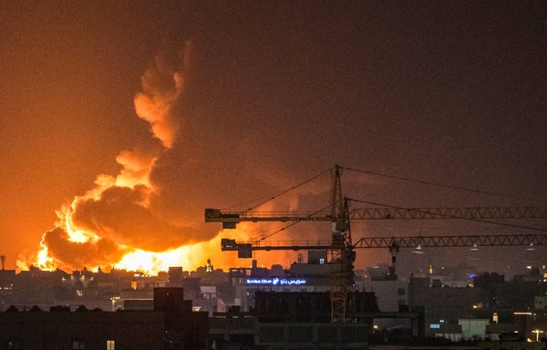 Smoke and flames rise from a Saudi Aramco oil facility in the Red Sea city of Jeddah, on March 25, following a reported attack by the Iran-backed Houthis. [Andrej Isakovic/AFP]
