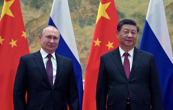 Russian President Vladimir Putin and Chinese President Xi Jinping pose during their meeting in Beijing, on February 4. China has sided with Russia since it invaded Ukraine February 24. [Alexei Druzhinin/ Sputnik/AFP]