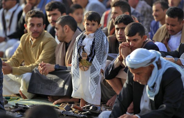 Yemenis attend the morning Eid al-Fitr prayer at a mosque in tSanaa on May 2. [Mohammed Huwais/AFP]