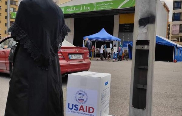 A woman in Beirut's southern suburbs received food aid from Hizbullah that in fact came from the US Agency for International Development (USAID) and the World Food Programme. [Twitter]