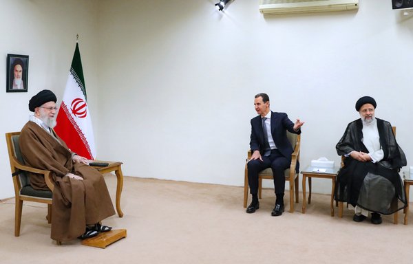 Syrian president Bashar al-Assad meets with Iranian leader Ali Khamenei and president Ebrahim Raisi in Tehran on May 8. [Khamenei.ir]