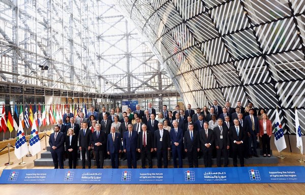Attendees pose for a picture during the 6th Brussels Conference on 'Supporting the future of Syria and the region' at the European Council in Brussels on May 10. [Kenzo Tribouillard/AFP]