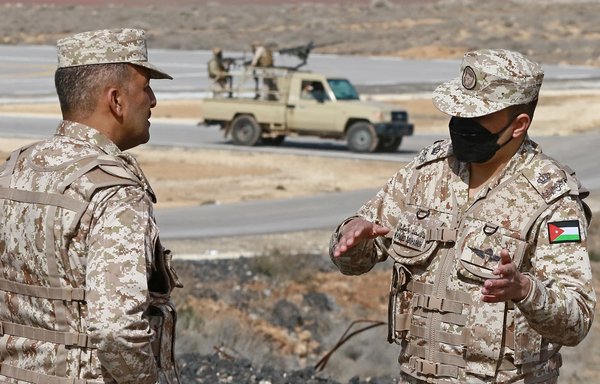 A picture taken during a tour organised by the Jordanian Army shows soldiers patrolling along the border with Syria to prevent smuggling, on February 17. Drug smuggling from Syria into Jordan is on the uptick, experts say. [Khalil Mazraawi/AFP]