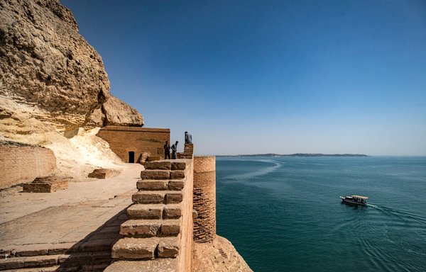 People visit the ruins of Qalaat Jaabar in Syria's Lake Assad reservoir in al-Raqa province on June 3. [Delil Souleiman/AFP]
