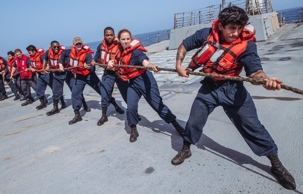 Sailors assigned to guided-missile destroyer USS Momsen and members of Patrol Squadron VP-46, operating with the US Navy's 5th Fleet, are seen in action on June 13. [US NAVCENT]