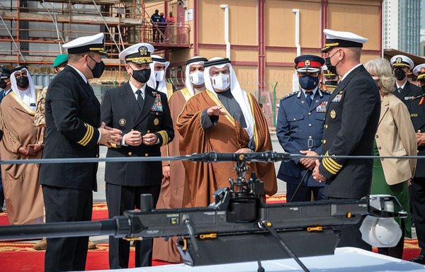 Prince Salman bin Hamad Al Khalifa, Crown Prince, Deputy Supreme Commander and Prime Minister of Bahrain (centre), receives a brief on the GHOST 4 unmanned aerial vehicle. [US Navy]