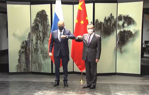 This screengrab taken on March 30 from video by state broadcaster China Central Television (CCTV) shows Russian Foreign Minister Sergey Lavrov (left) meeting his Chinese counterpart Wang Yi in Huangshan, Anhui province, during his first visit to China since Moscow launched its invasion of Ukraine in February. [STR/AFPTV/CCTV/AFP]